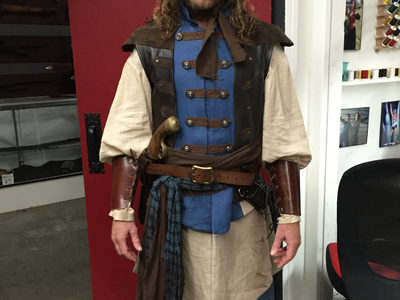 This original pirate costume was designed and fabricated by Castle Corsetry for a swashbuckling film. 	